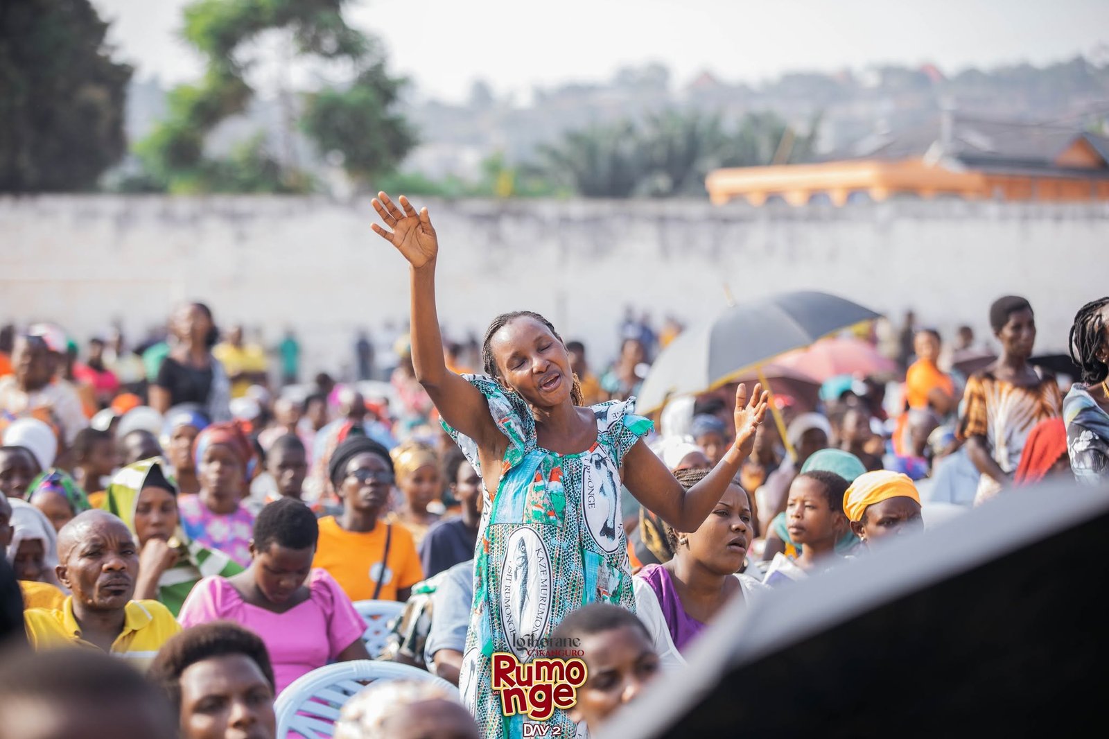 A woman worshipping with raised hands in Rumonge